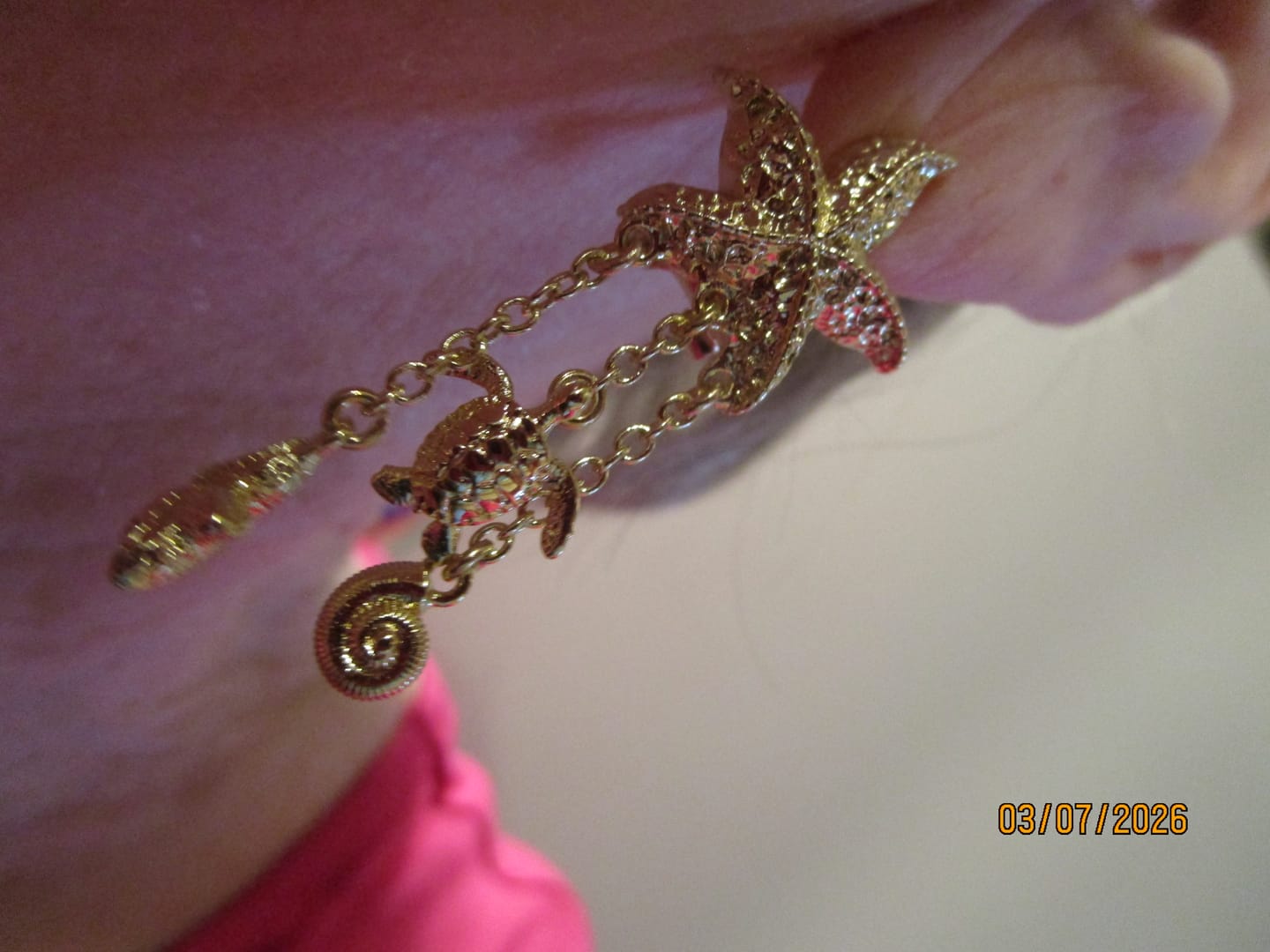 Customer photo review of Heidi Daus ® "Ocean Charm" Sea Life Dangle Earrings