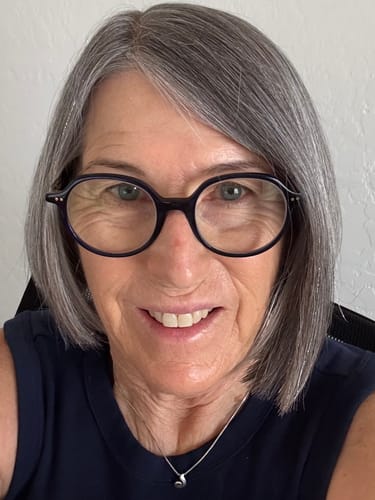 Reviewer's smiling face, showing healthy-looking skin after using The Micro Infusion System.