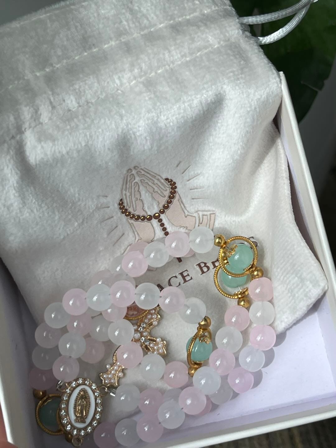 Customer photo review of SolaceBeads Artistic Pink & White Beaded Rosary: A Fusion of Colors & Sacred Symbols