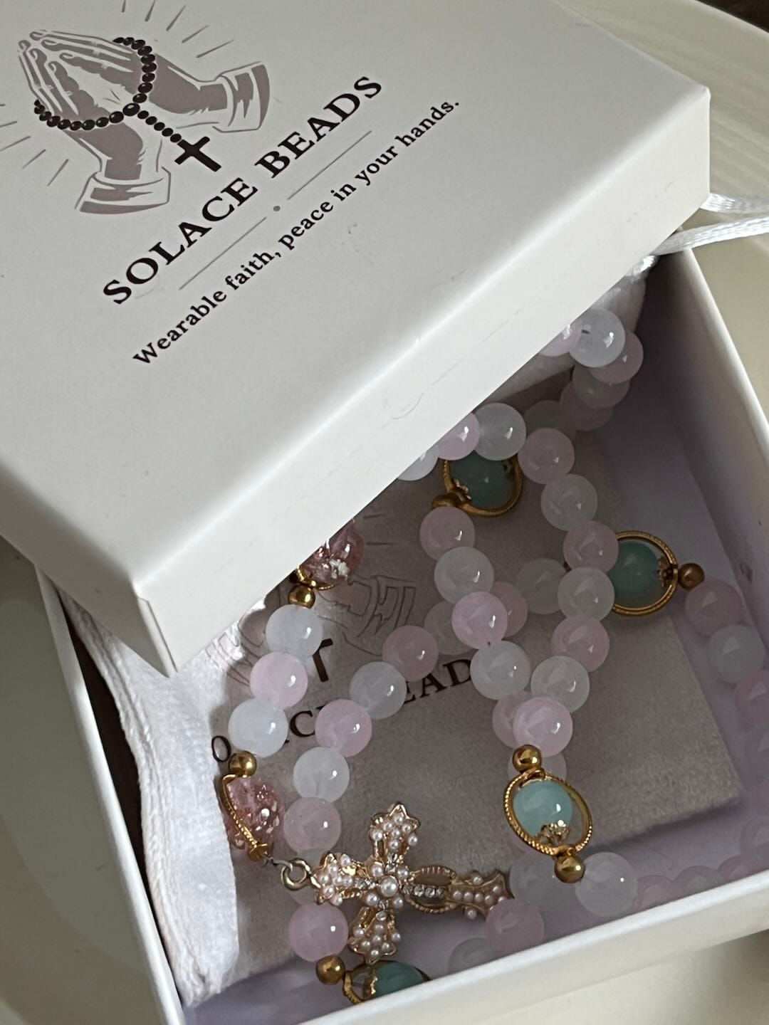 Customer photo review of SolaceBeads Artistic Pink & White Beaded Rosary: A Fusion of Colors & Sacred Symbols