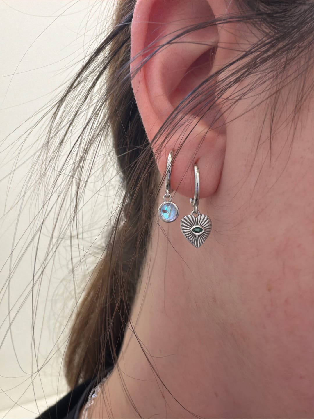 Customer photo review of Emerald Evil Eye Heart Huggie Hoop Earrings