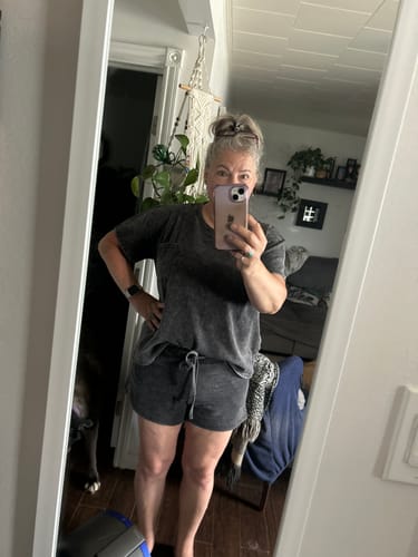 Reviewer taking a mirror selfie, showing the fit of the gray Zen French Terry Lounge Shorts Set.