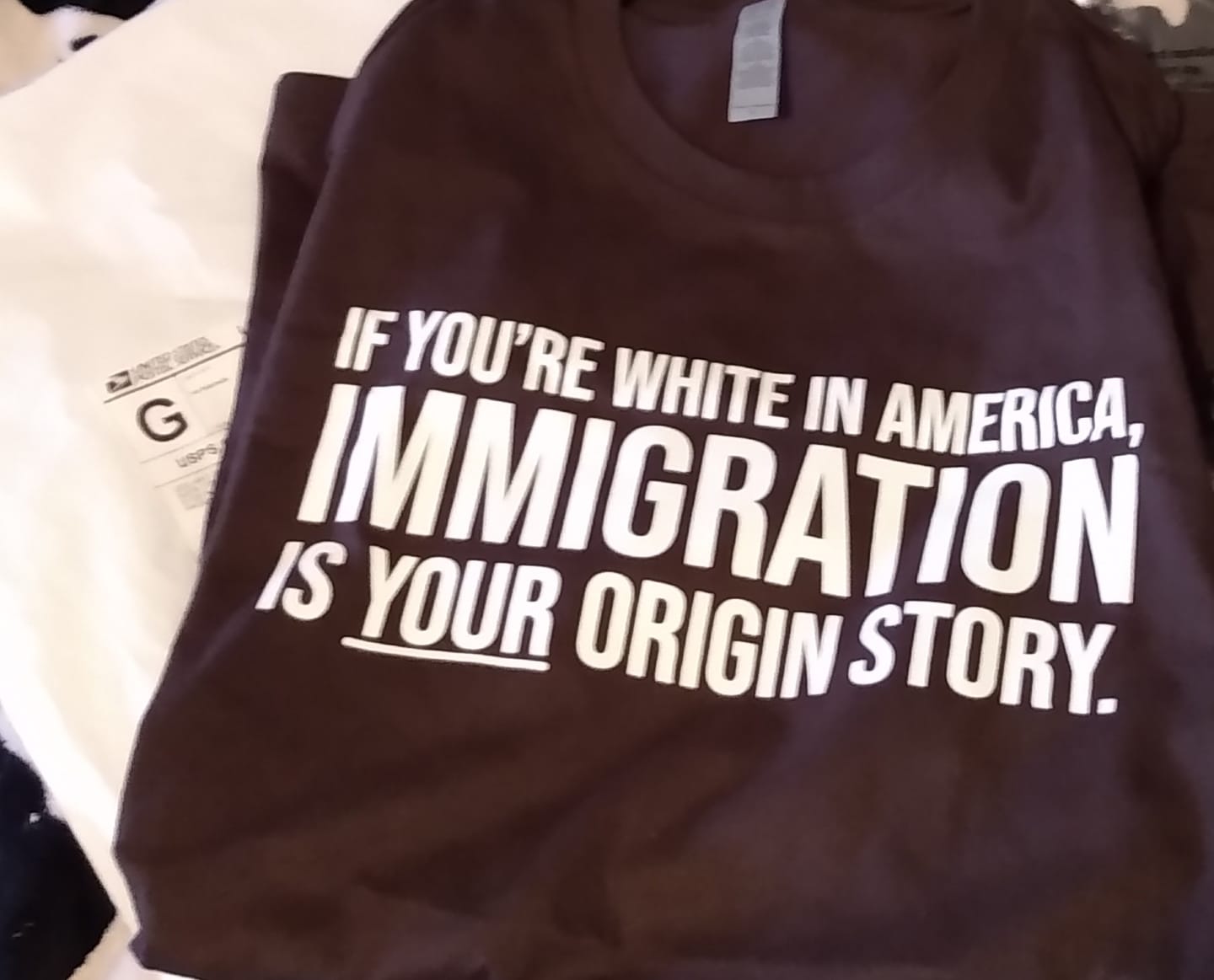 Customer photo review of If you're white in America, IMMIGRATION is your origin story Unisex Tee