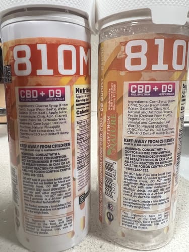 Reviewer shows the back of two product bottles, comparing the ingredient labels.