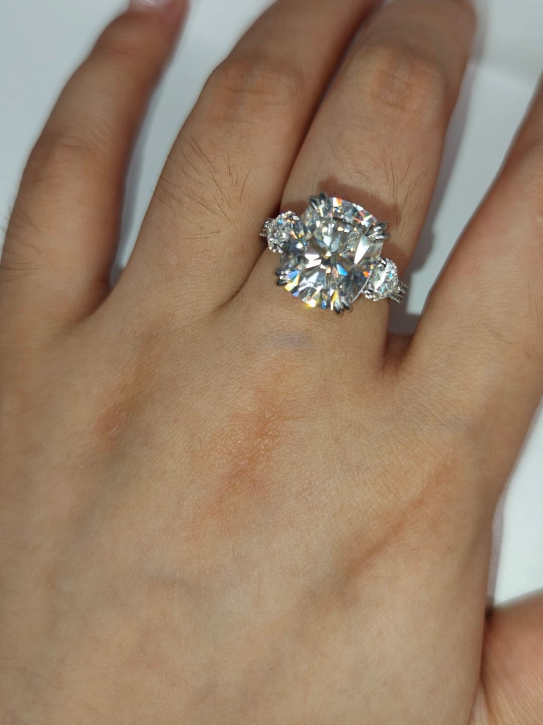 Customer photo review of Moissanite 6.0Ct Cushion Cut Three Stone Engagement Ring In Sterling Silver