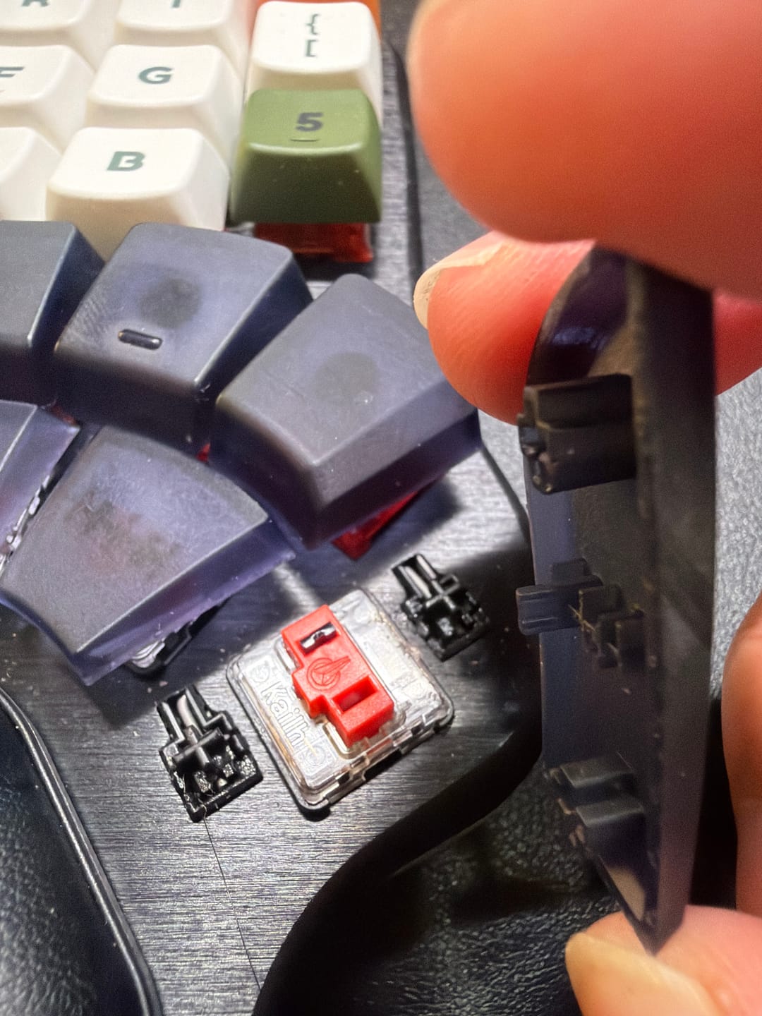 Customer photo review of Dygma Defy Thumb Cluster Keycap Set