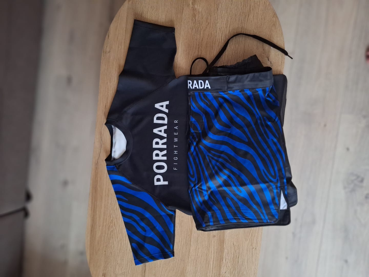 Customer photo review of IBJJF BLUE RANKED SHORT SLEEVE RASH GUARD