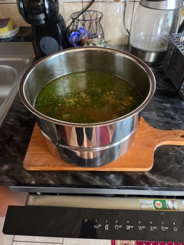 Customer's stainless steel pot from the Novio SteelCook multicooker, filled with a freshly made soup.
