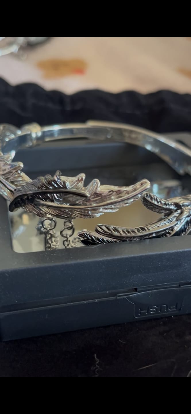 Customer photo review of Divine Plume Dove＆Crow 18K Platinum Plated Black＆Silver Wings Arm Ring™