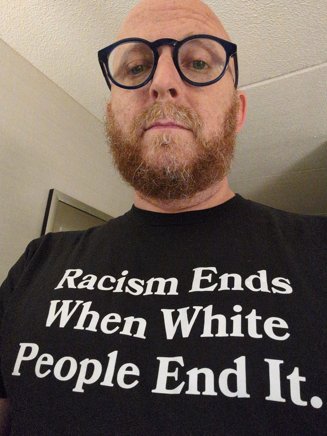 Customer photo review of Racism Ends Unisex T-Shirt