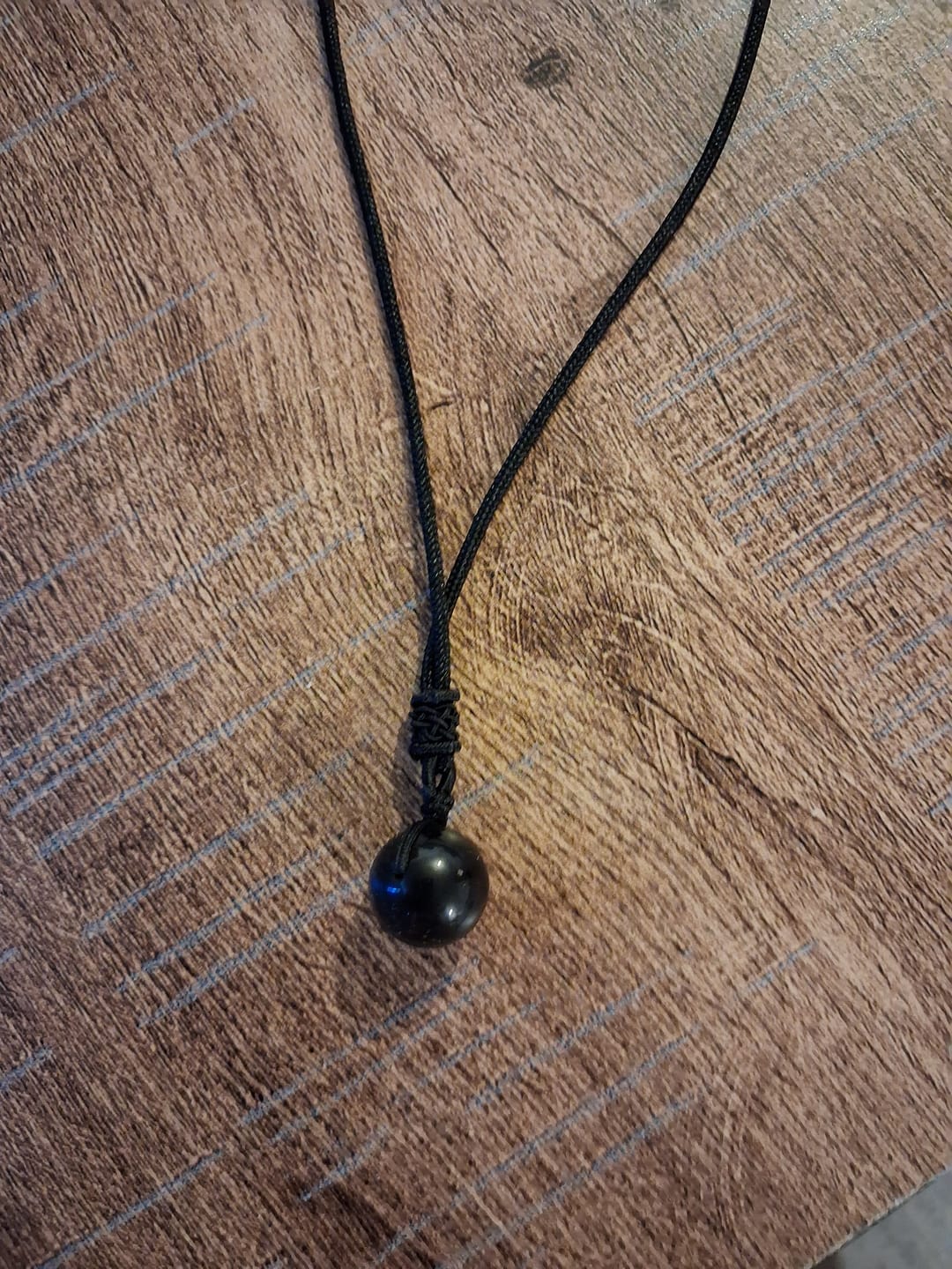 Customer photo review of Pendentif "Sphère" en Obsidienne Dorée