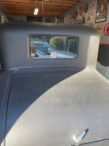 Customer's Cut to Shape Sticker featuring a design applied to the rear window of a vintage vehicle.