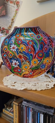 Customer's Diamond Painting Ornament featuring colorful, intricate flower designs on a decorative stand.