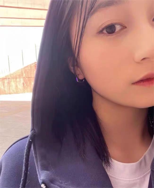 Customer photo review of Luminous Tritium Mobius Earrings