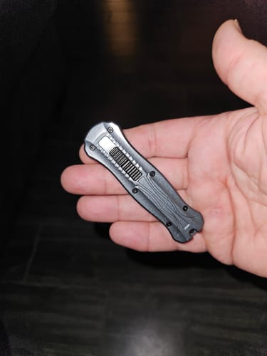 Customer's VT Rocket Mini OTF knife held in hand while retracted