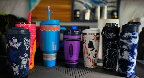 Customer's Ghostbusters Stay Puft To-Go Buddy tumbler displayed in a row with several other colorful tumblers.