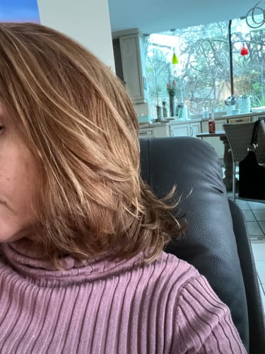 Reviewer's fine hair after using Hannon More Hair Volumising Conditioner, showing smooth and volumized strands.