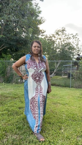Customer's Loose Sleeveless Contrast Color Maxi Dress worn outdoors in a garden setting.