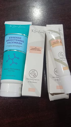 Customer's pack of two Lip Cream tubes and one Essense Brightening Facewash bottle on a dark surface.