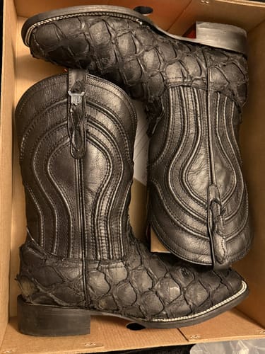 Customer's matte black jumbo pirarucu leather boots with square toes inside the box.