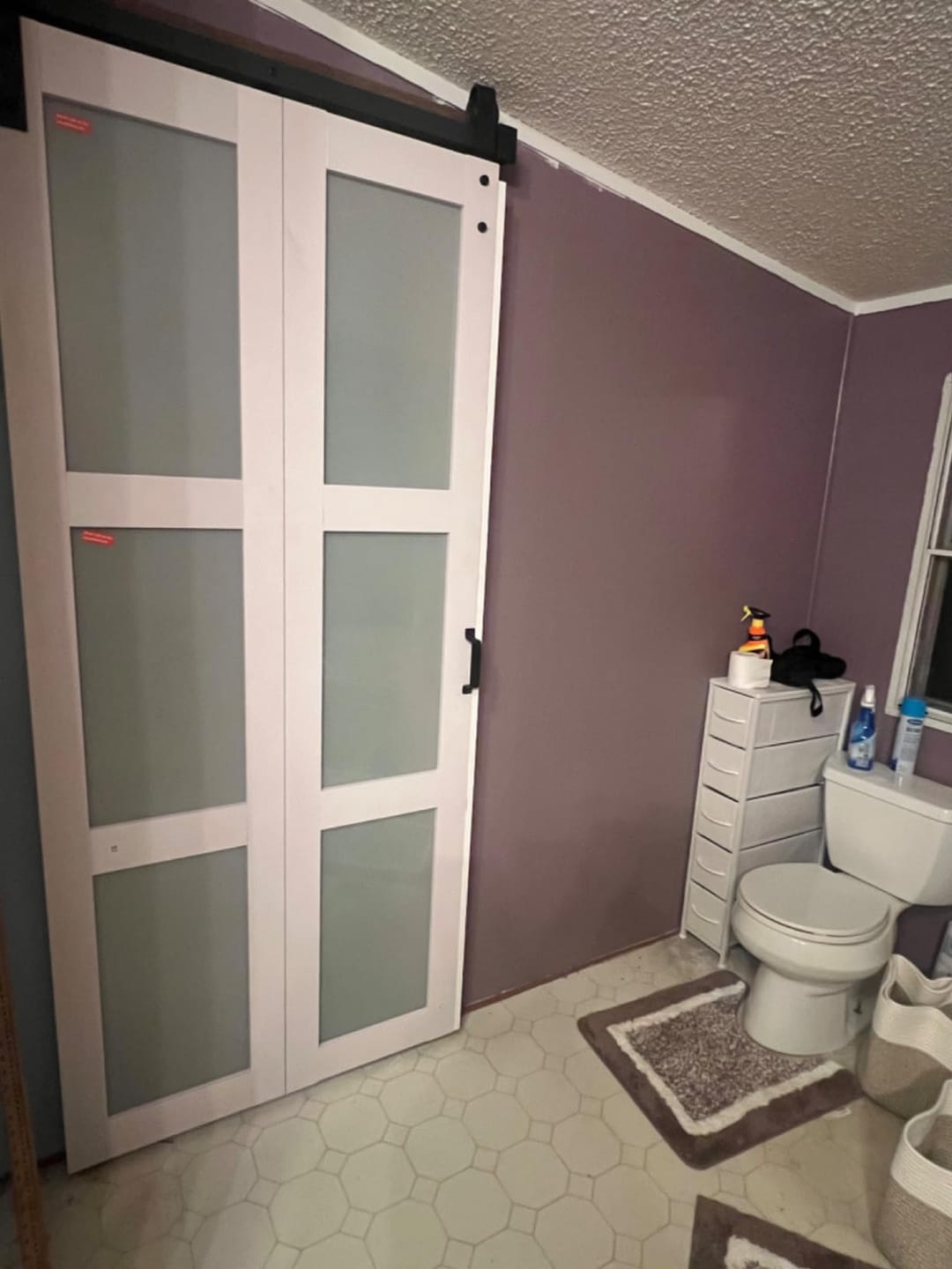 Customer photo review of TENONER White MDF 3-Lite Tempered Frosted Glass Bi-Fold Sliding Barn Door for Closet, Bedroom - Space-Saving and Pre-Drilled