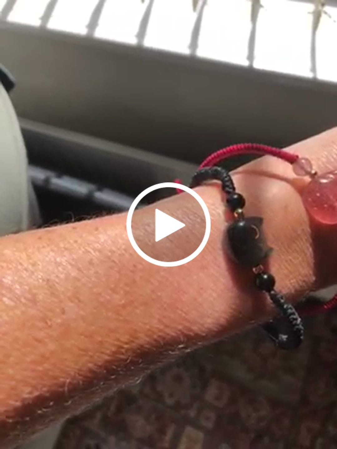 Customer video review of Buddha Stones Handmade Natural Silver Sheen Obsidian Strawberry Quartz Cute Cat Protection Braided Bracelet