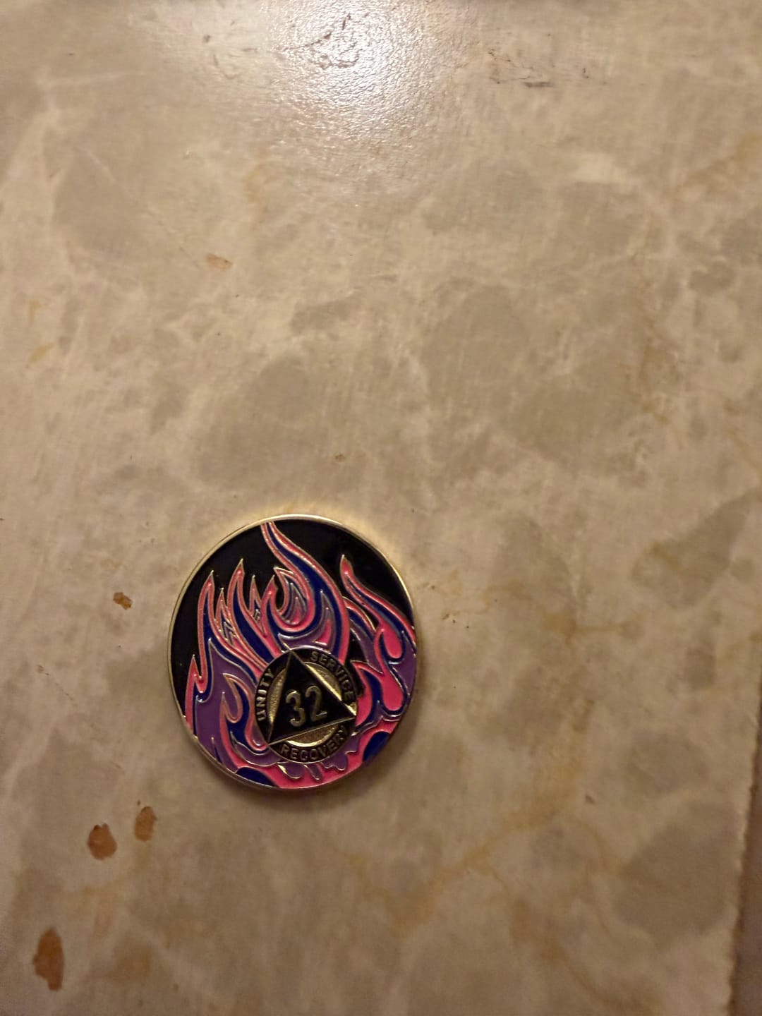 Customer photo review of 32 Year Sobriety Mint Twisted Flames Gold Plated AA Recovery Medallion - Thirty Two Year Chip/Coin - Black/Pink/Purple/Blue