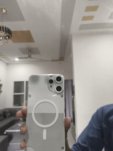 Customer's hand holding a clear, transparent Nothing CMF 2 PRO phone case with a MagSafe ring on the back.