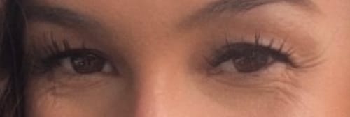 Reviewer's eyes with THE MAIN CHARACTER lash extensions applied, showing natural-looking, spiky lashes.