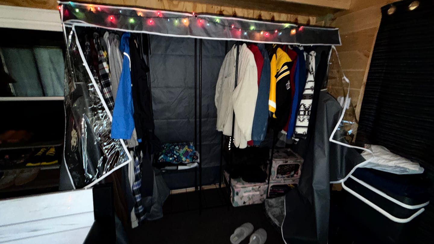 Customer photo review of Raybee 90.6''W Heavy Duty Clothes Rack with Cover,1200lbs Freestanding Garment Rack for Bedroom