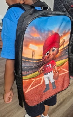 Reviewer's child wearing the personalized baseball backpack with the character graphic visible on the back.
