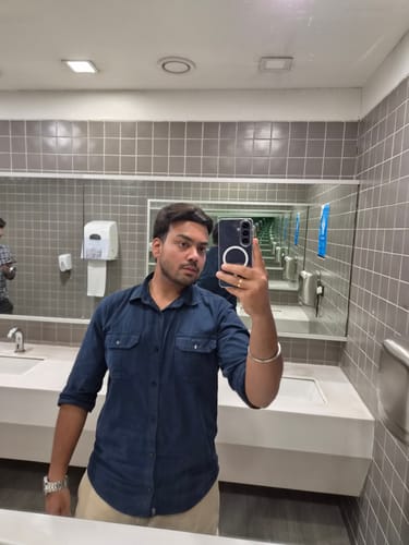 Customer's Anti Yellow Magsafe Clear Case for Samsung Galaxy S26 on a phone held in a bathroom mirror selfie