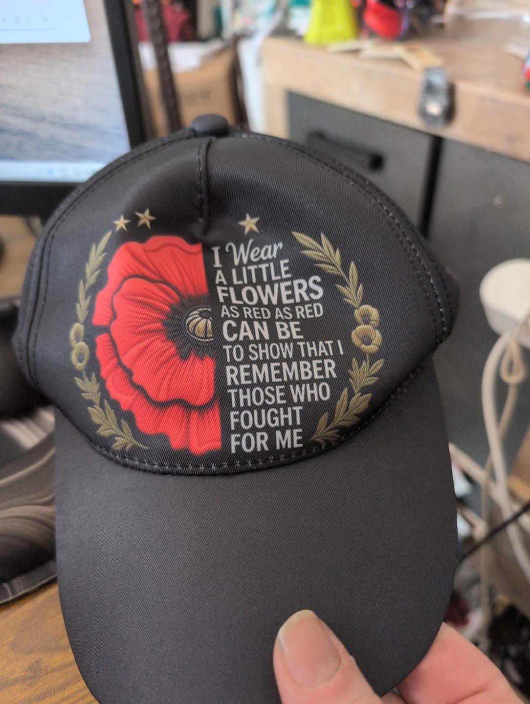 Customer photo review of 🧢"Lest We Forget" Remembrance Flowers Baseball Cap - Meaningful Patriotic Gift for Veterans & Family