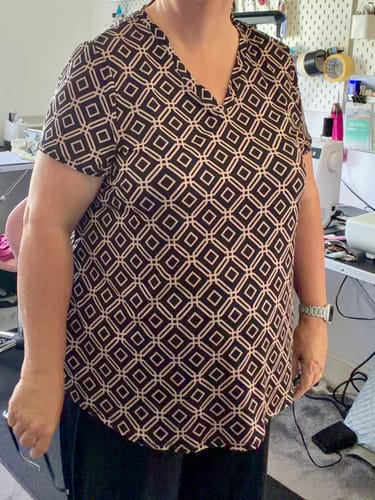 Customer's Diamond Grid Jersey Fabric worn as a v-neck t-shirt with a black and white diamond pattern.