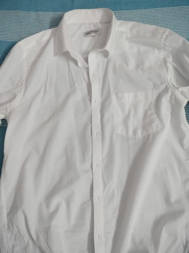 Customer's crisp white shirt from the Double Delight combo pack, shown laid flat.