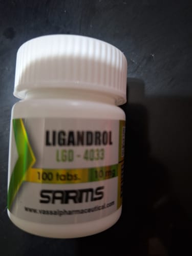 Customer's Ligandrol LGD-4033 bottle, white plastic container with printed label, close-up.