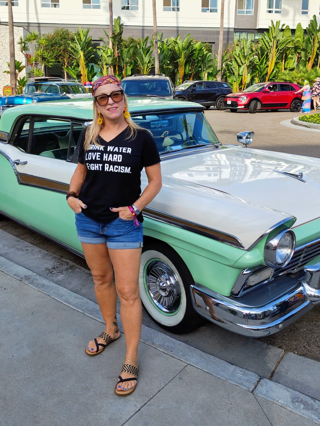 Customer photo review of Drink Water Fight Racism V-Neck Tee