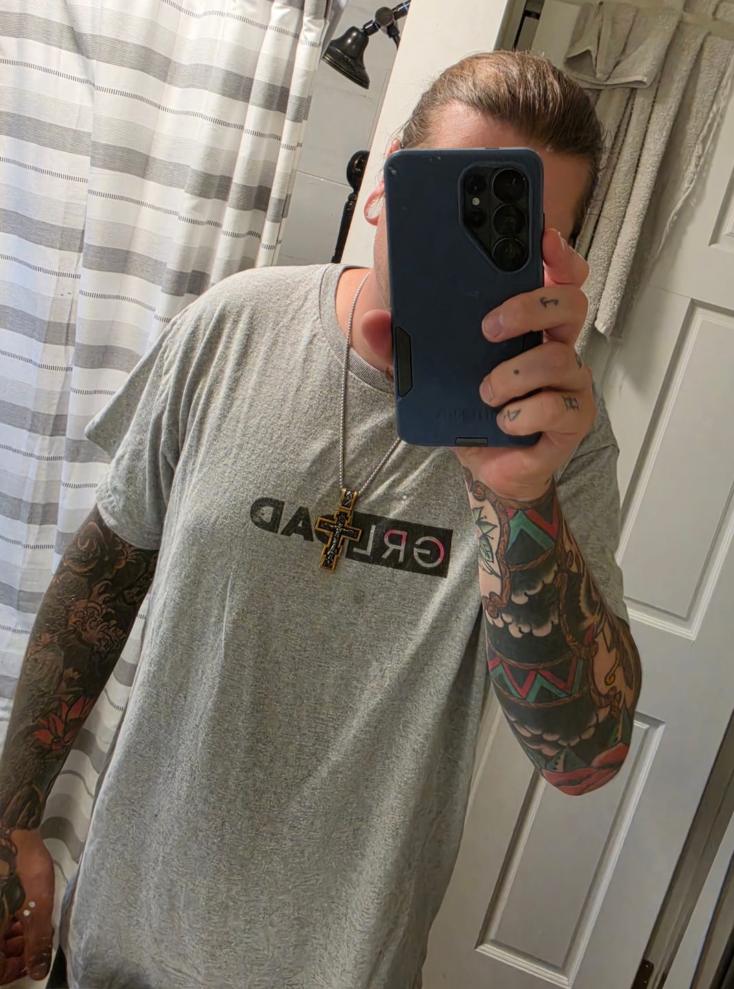 Customer photo review of DARK JESUS CROSS. - GOLD