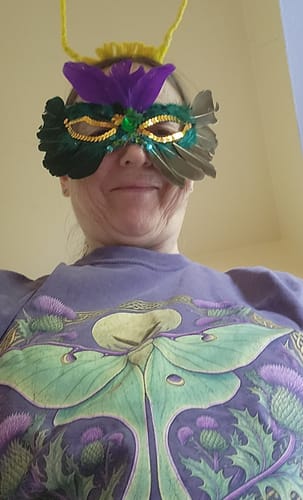 Customer's Thistle Luna Moth T-Shirt worn by a person wearing a decorative moth mask and antennae at an event.