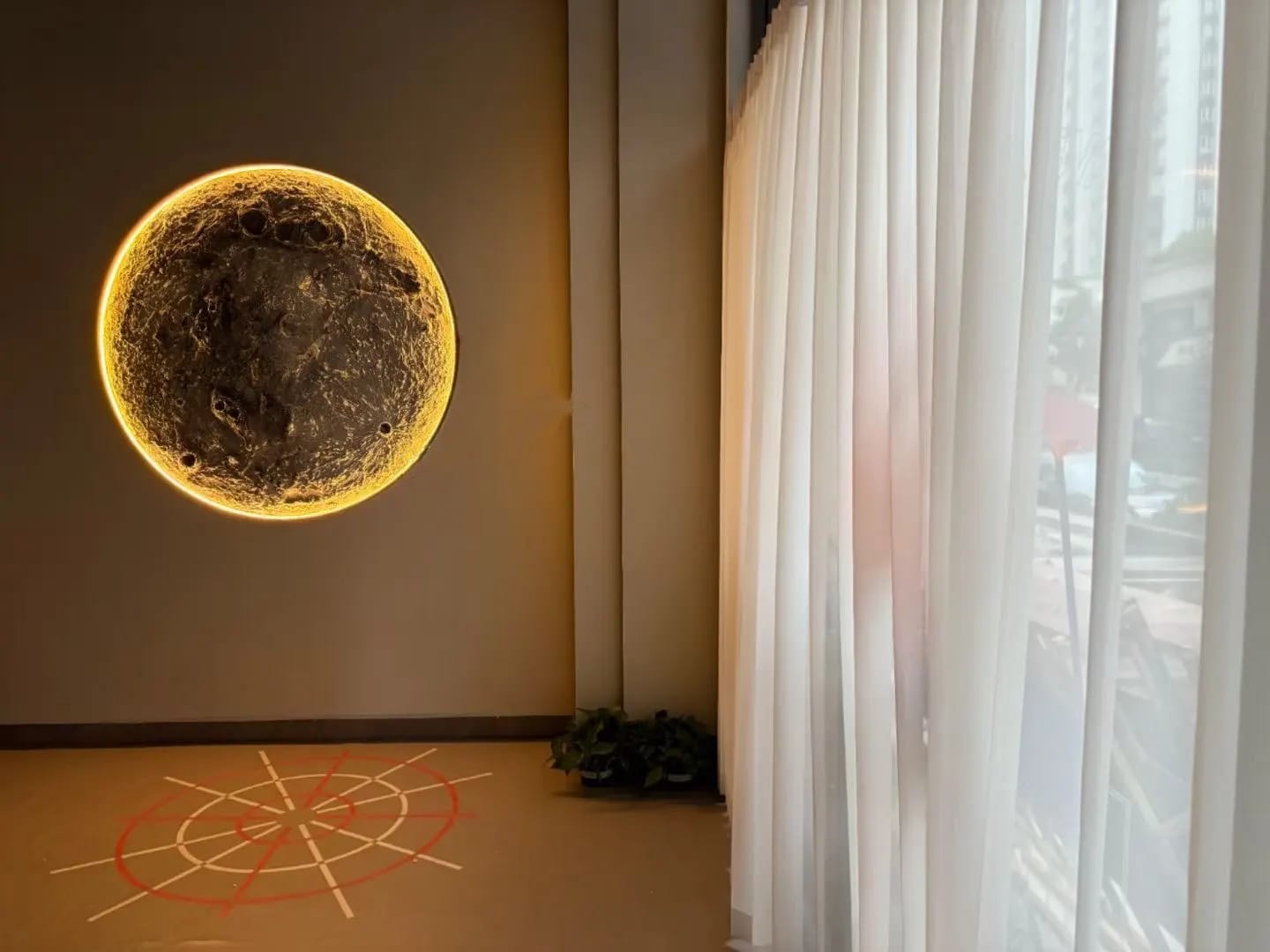 Customer photo review of Rebellious Crescent Moon Wall Sconce, Aluminum Concrete-Look Outdoor Finish