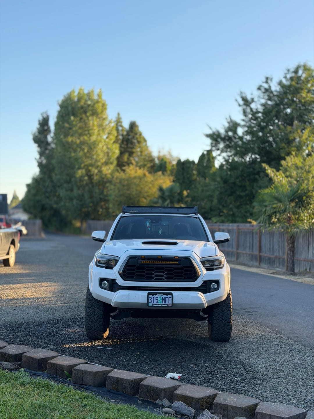 Customer photo review of 2016-2023 Tacoma Apex Pro Style Grille with LED Light Bar & Raptor Lights by YotaTribe