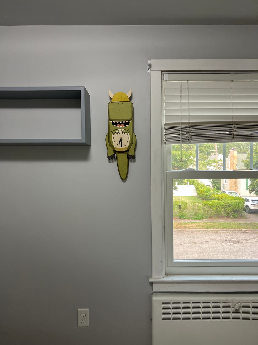 Customer photo review of Ralphie the T-Rex Pendulum Clock