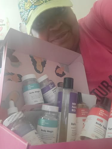 Customer's Body Magic Chlorophyll Pill bottles and other skincare items inside a pink promotional box.