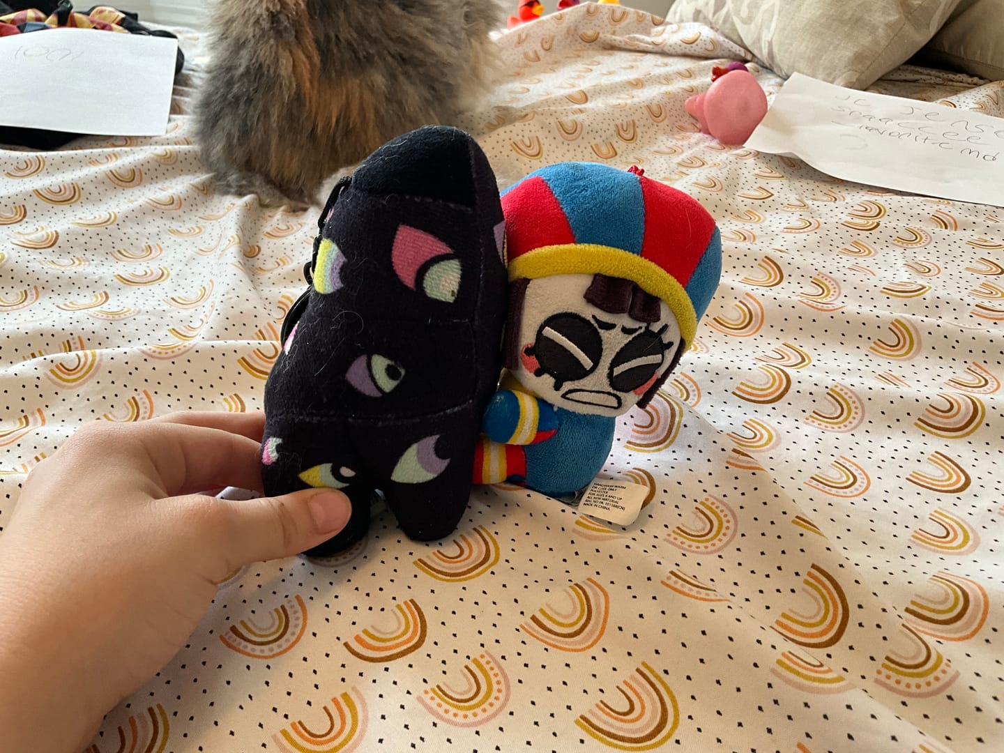 Customer photo review of Pomni & Abstraction Magnetic Plush Keychains