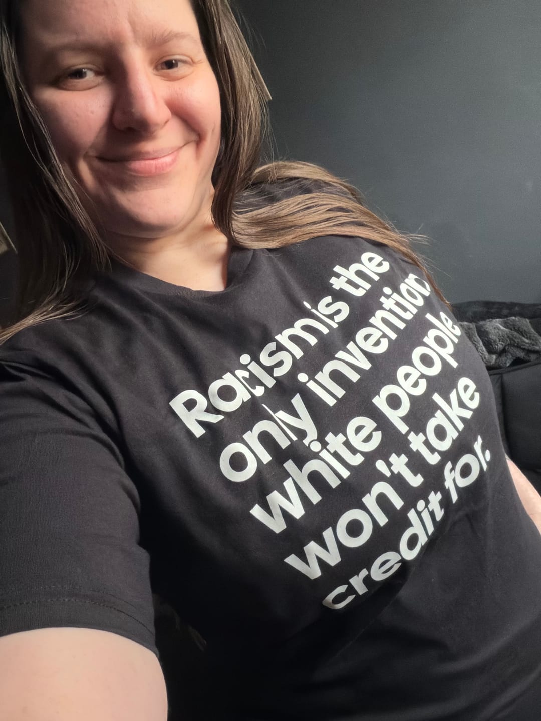 Customer photo review of Racism Is the Only Invention White People Won’t Take Credit For Unisex Tee