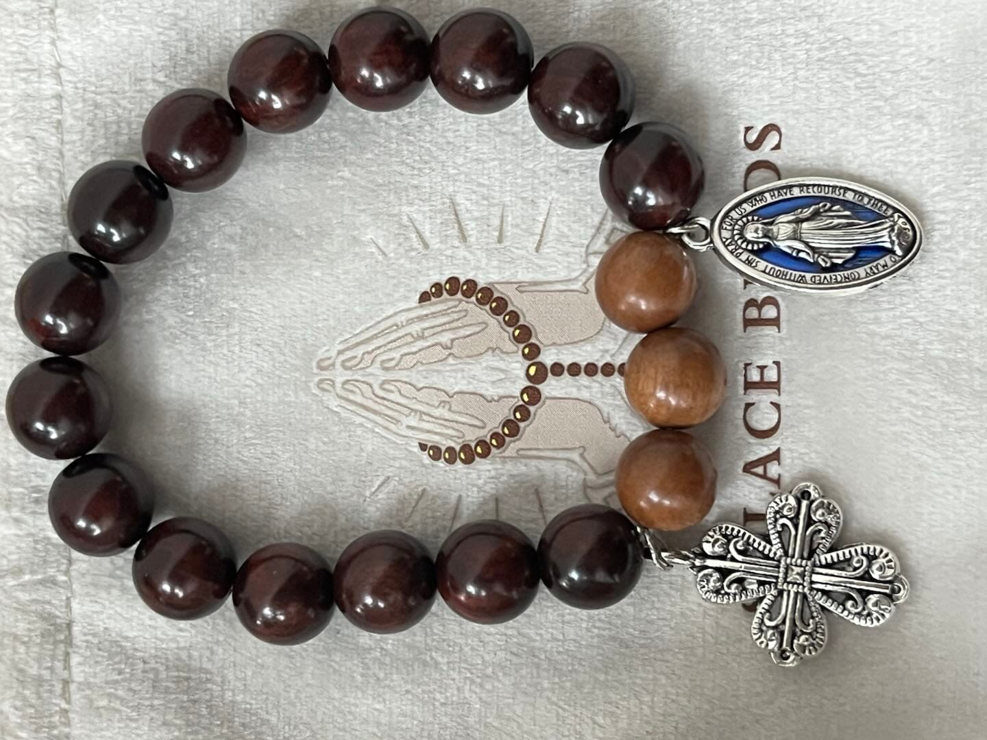 Customer photo review of Solacebeads Sandalwood & Peach Wood Bracelet With Miraculous Medal & Cross: Peace in Natural Grain