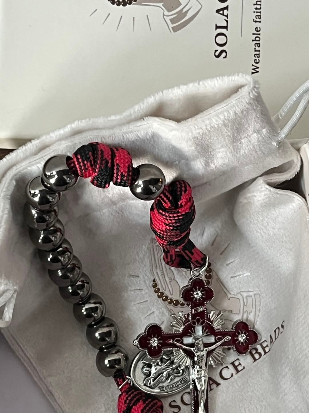 Customer photo review of Solacebeads Gunmetal Bead Car Rosary & Red Enamel Crucifix: Rooted In St. Michael Protection