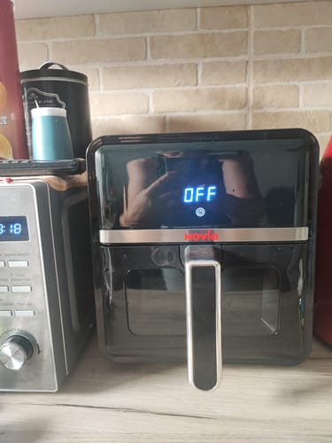 Customer's black Novio StonePro air fryer sitting on a kitchen counter with the display showing OFF.