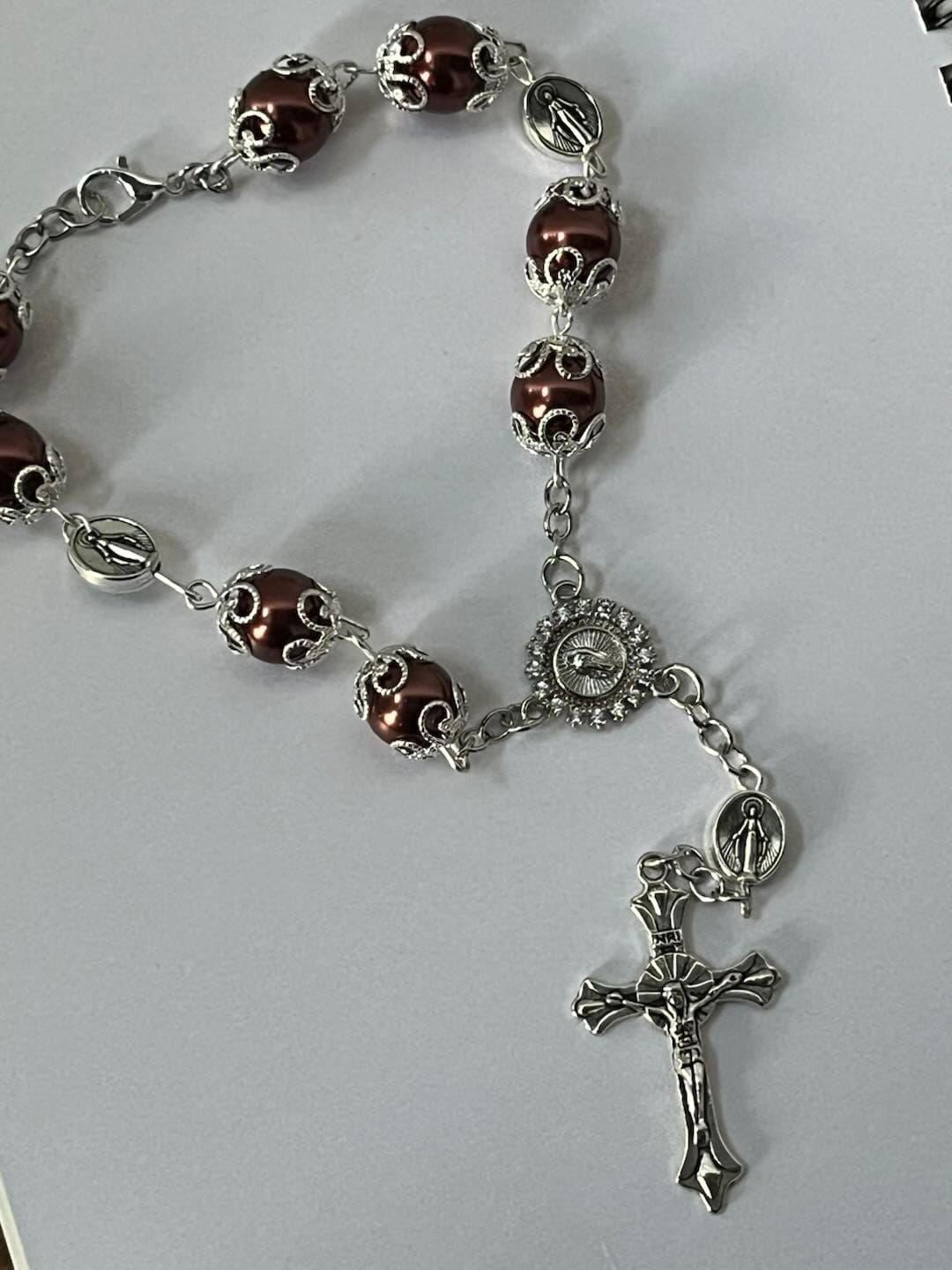Customer photo review of SolaceBeads Handcrafted Car Rosary, White & Reddish Brown Pearl Beads with Medal & Cross: Serene Vibe