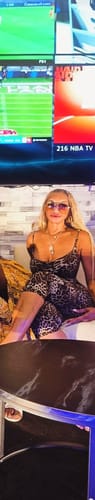 Reviewer's Naked Print Capri Jumpsuit in a leopard print worn while seated.
